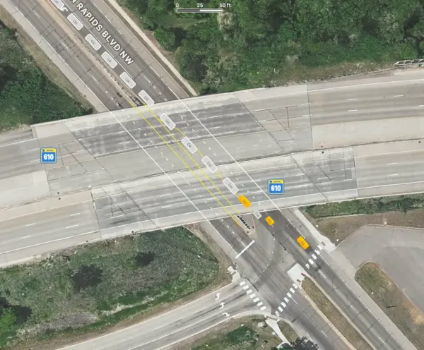Intersection of MN610 and Coon Rapids Blvd., with lines and cars